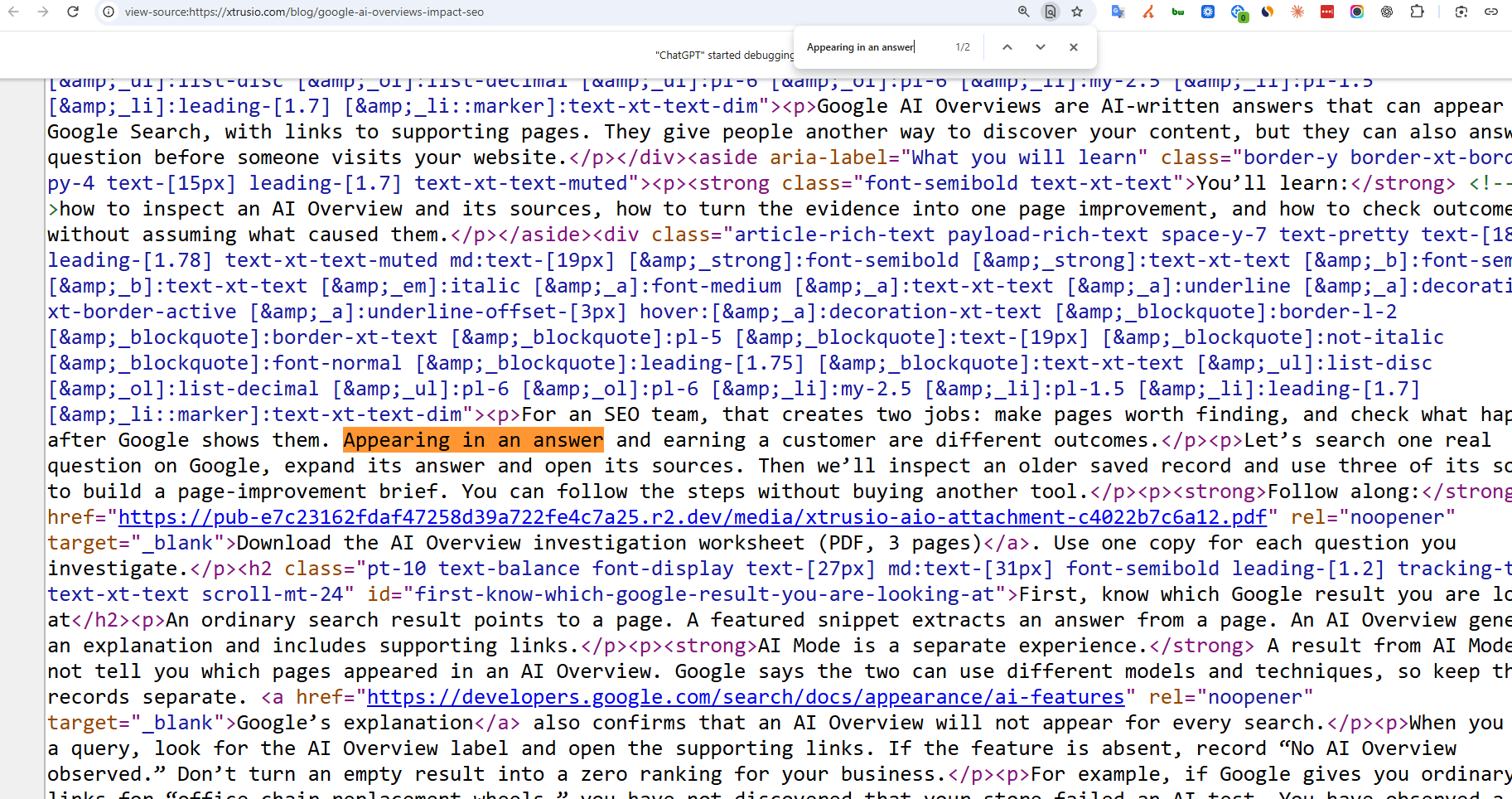 Chrome's source view for the Google AI Overviews article, with Appearing in an answer highlighted inside a paragraph and the exact article URL visible.
